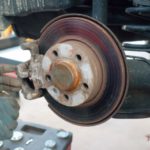 disc_brake_stainless_auto_repair_workshop_repair_work_gloves_lift_auto_mechanic-685635