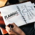 Woman writing and planning business strategy