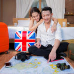 Young couple planning honeymoon vacation trip