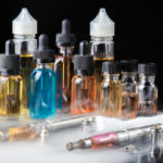 Collection of vape equipment with smoke