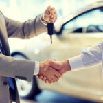 close up of handshake in auto show or salon