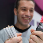 man holding a electronic cigarette