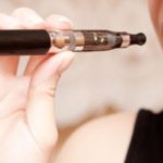 20020498 – close up of a woman inhaling from an electronic cigarette