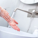 Woman washing hands with foam soap. Hygiene, preventing coronavirus