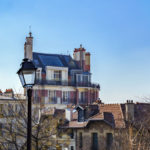 Montmartre Cityscape with street lamp in foreground – Paris