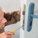 Carpenter Repairing Door Lock